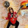 B'z松本孝弘さん60歳の還暦で赤いギター、レザージャケット、サングラス姿とメッセージとGUITAR BOOK発売